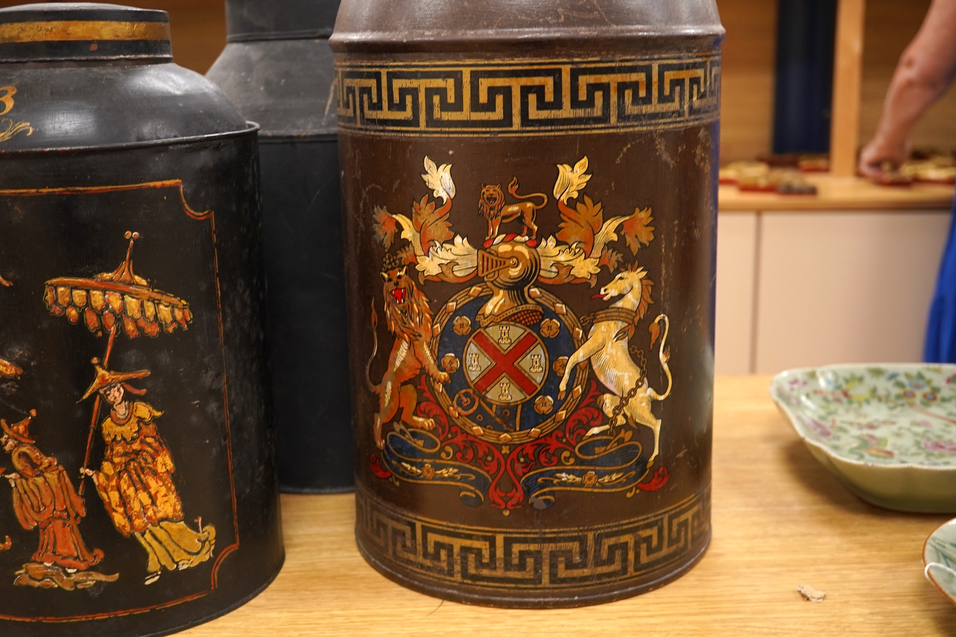 Five 19th century toleware tea canisters, largest 43cm